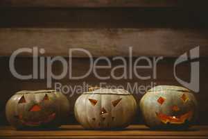 Jack o lanterns arranged on table during Halloween