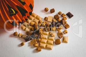Chocolates with decoration over white background