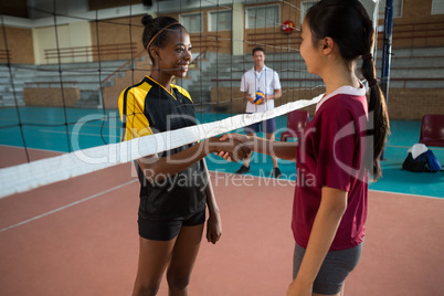 Two female players shaking hands with each other