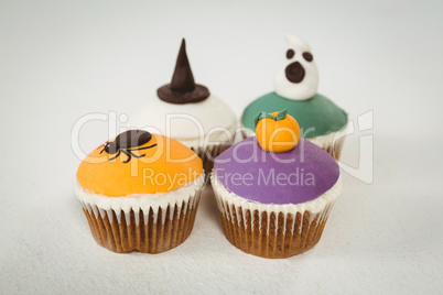 Colorful cup cakes on white background