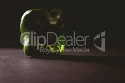 Carved green bell pepper on table