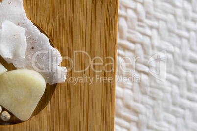 Close-up of cheese with fruit on cutting board