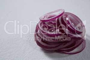 Sliced onions on a white background