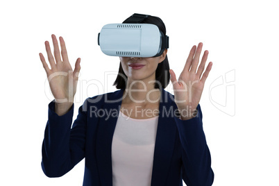 Businesswoman gesturing while using virtual reality headset