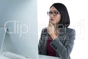 Businesswoman working on desktop pc