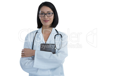 Portrait of happy female doctor standing with arms crossed