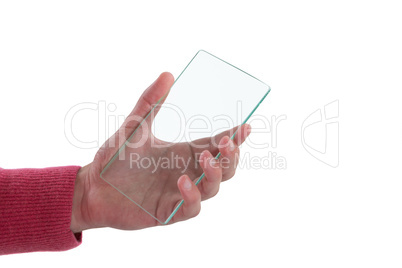 Close-up of man holding glass mobile phone