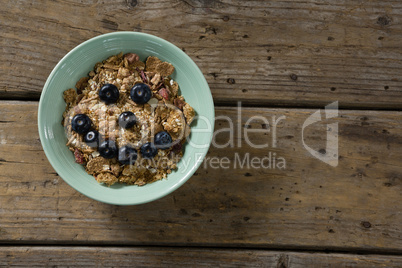 Oats with blueberries forming smiley face