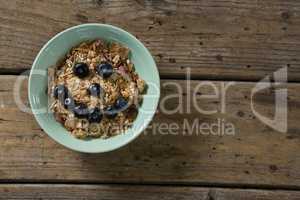 Oats with blueberries forming smiley face