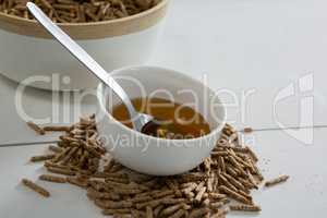 Cereal bran sticks and honey in bowl