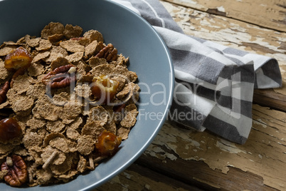 Bowl of wheat flakes and dried fruits