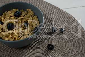 Bowl of wheat flakes and blueberry