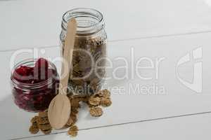 Raspberry and wheat flakes in glass jar