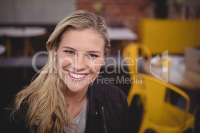 Close-up portrait of smiling young pretty woman