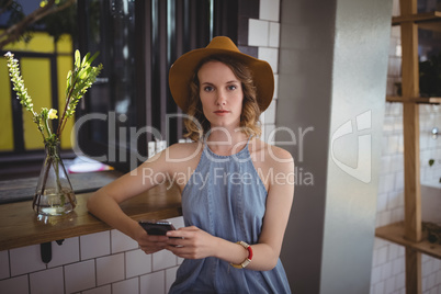 Portrait of young woman using smartphone