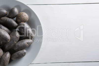 Overhead view of sweet potatoes in plate on table