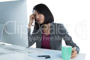 Tired businesswoman sitting at desk