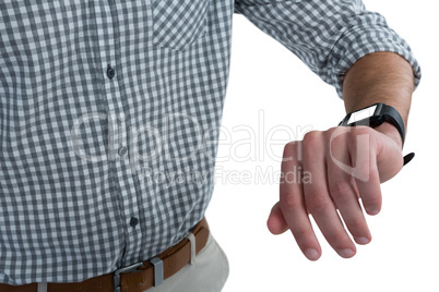 Mid section of man wearing smartwatch Mid section of man wearing smartwatch