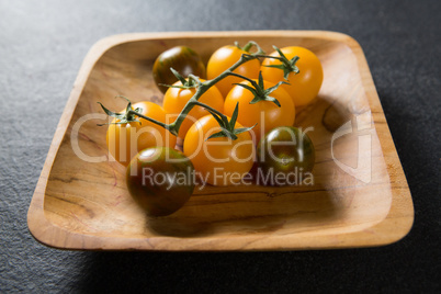 Cherry tomatoes in plate on slate