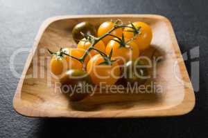 Cherry tomatoes in plate on slate