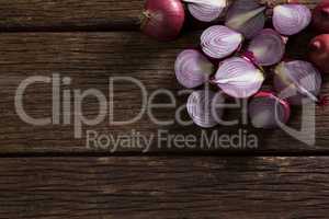 Halved onions on wooden table
