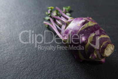 Close-up of purple root vegetable on slate