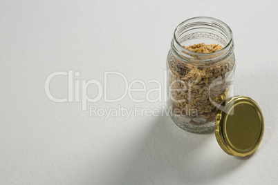 Homemade granola or muesli in open glass jar