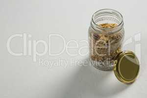 Homemade granola or muesli in open glass jar