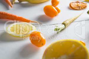 Close-up of tomato with orange fruits