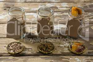 Three jar with various breakfast cereals