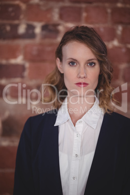 Portrait of confident young attractive female editor at coffee shop