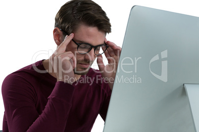 Stressed man sitting at desk