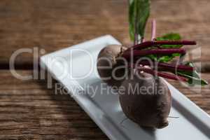 Beetroots in a tray on wooden table
