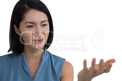 Female executive pretending to hold invisible object