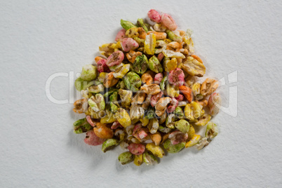 Multi-colored granola on white background