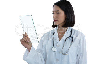 Female doctor holding a glass digital tablet