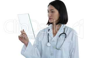 Female doctor holding a glass digital tablet