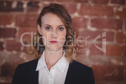 Close up portrait of confident young beautiful female editor at coffee shop