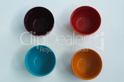 Colorful empty bowls on white background