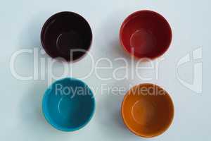 Colorful empty bowls on white background