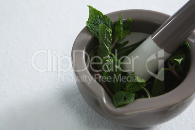 Holy basil in mortar pestle