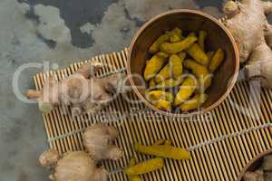 Ginger and turmeric stick on bamboo placemat