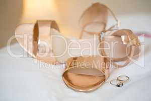 Close-up of sandals with rings on table