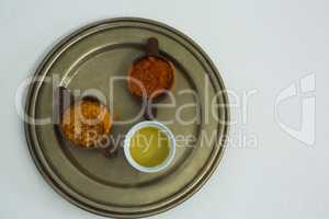 Spices powder with oil in bowl