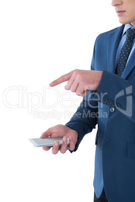 Mid section of businessman gesturing over mobile phone