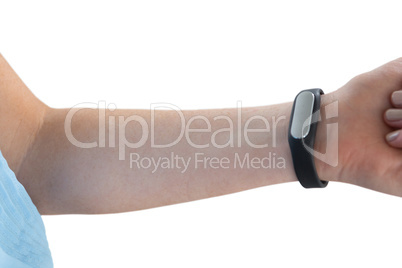 Cropped hand on woman wearing fitness tracker