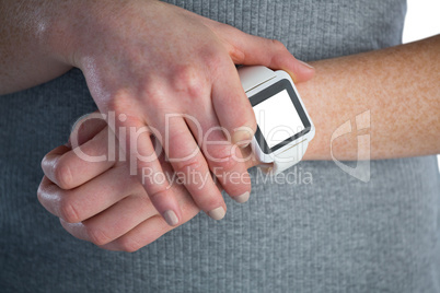 Businesswoman adjusting smart watch