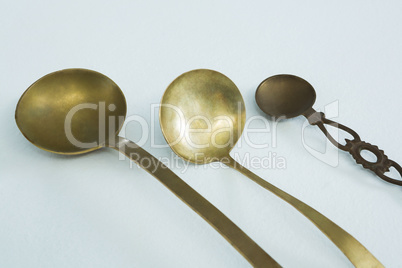 Various serving spoons on white background