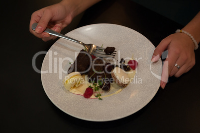 Woman having dessert at table