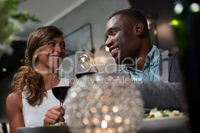 Happy couple toasting wine